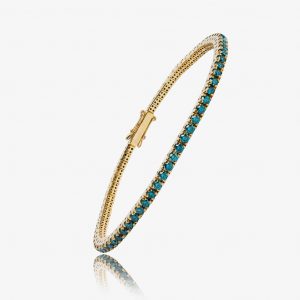 Bracelet en or serti de pierres précieuses bleues, idéal pour harmoniser l’énergie astrologique selon votre signe du zodiaque. Un bijou raffiné alliant élégance et spiritualité.