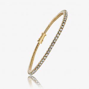 Bracelet en or jaune avec diamants, symbole de chaleur et de tradition pour un look intemporel